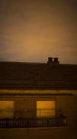 Low angle view of building against sky during sunset