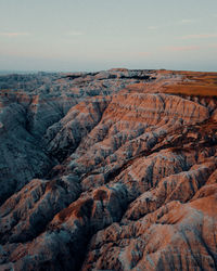 Scenic view of rock formations against sky