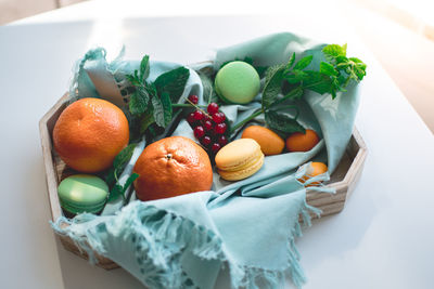 High angle view of fruits in basket on table