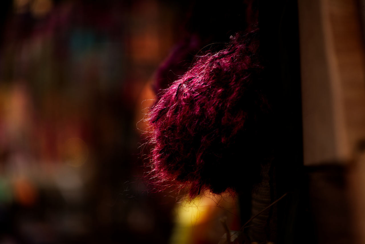 HIGH ANGLE VIEW OF WOMAN WITH PINK LIGHT PAINTING