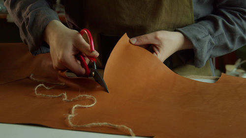 High angle view of woman holding paper