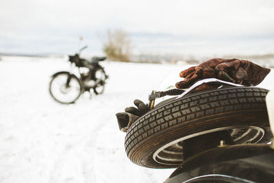 Man cycling on snow covered land