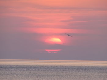 Scenic view of sea against sky at sunset