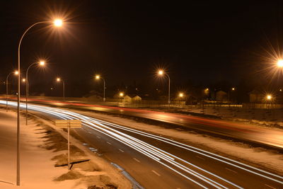 Light trails on road at night