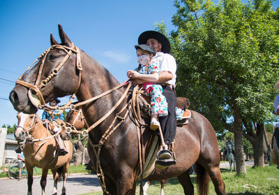 South american father and daughter in traditional festival