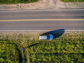 High angle view of street amidst field