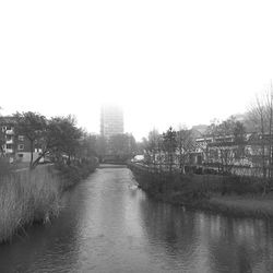 River passing through city against clear sky