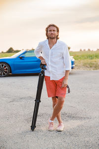 Full length of man standing on road