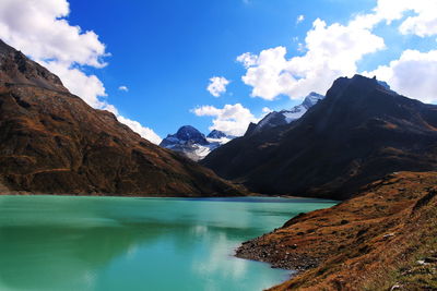 Scenic view of mountains against cloudy sky