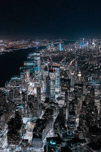 Aerial view of illuminated city buildings at night