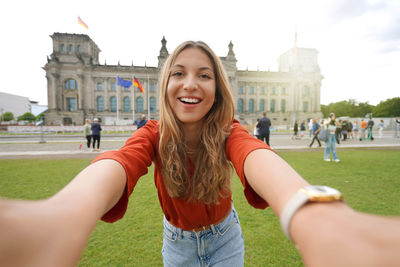 Self portrait of nice excited school exchange girl visiting europe within the exchange program