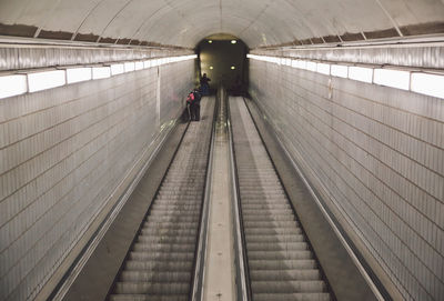 High angle view of illuminated escalator in subway station