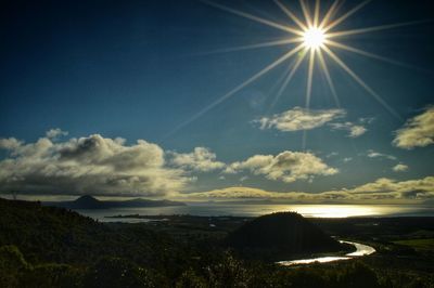 Sun shining over landscape