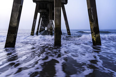 Pier on sea against sky