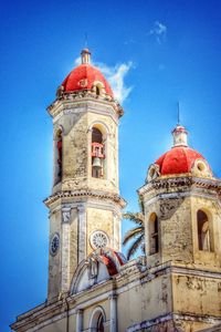 Low angle view of building against blue sky