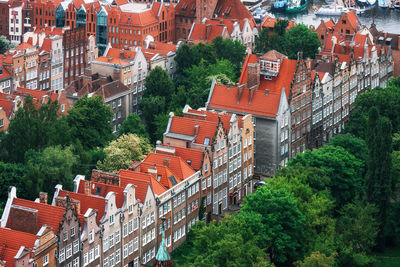 High angle view of red tile roof buildings in town