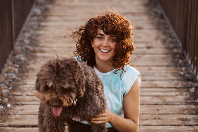 Portrait of young woman with dog