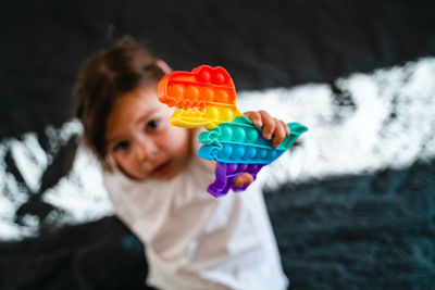 Portrait of girl holding toy