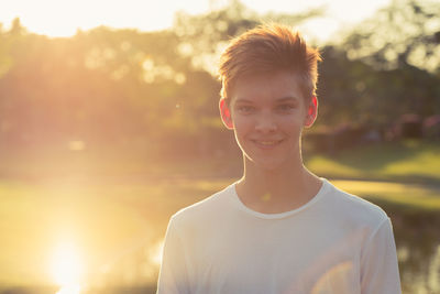 Portrait of smiling boy standing outdoors