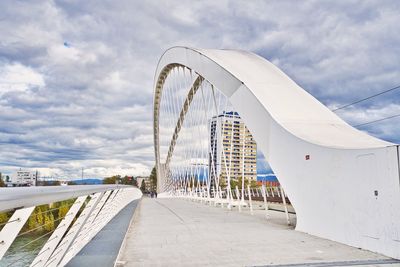 View of bridge against cloudy sky