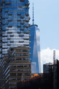 Low angle view of modern buildings against sky