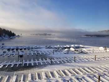 Scenic view of frozen lake against sky