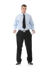 Portrait of young man standing against white background