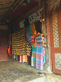 Multi colored umbrellas hanging at market stall