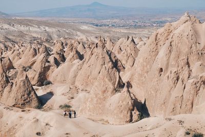 High angle view of tourists at badlands