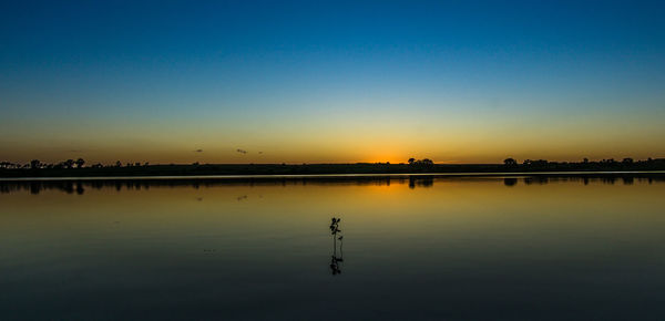 Scenic view of sea at sunset