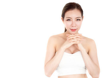 Portrait of a beautiful young woman over white background