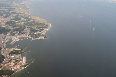 High angle view of sea and buildings in city