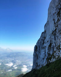 Scenic view of mountain against clear blue sky