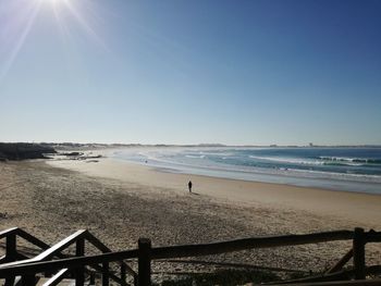 Scenic view of beach against clear sky