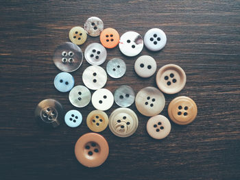 High angle view of buttons on table