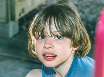 Close-up portrait of girl with short hair and blue eyes
