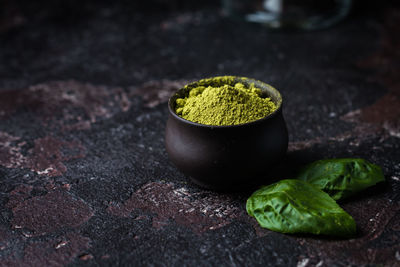 Close-up of green leaves on table