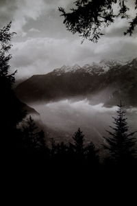 Scenic view of silhouette mountains against sky