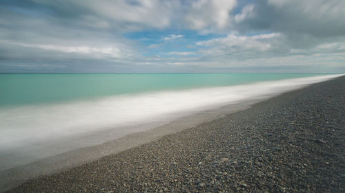 Scenic view of calm sea against sky