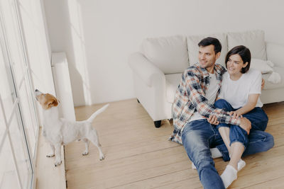 Young couple kissing at home