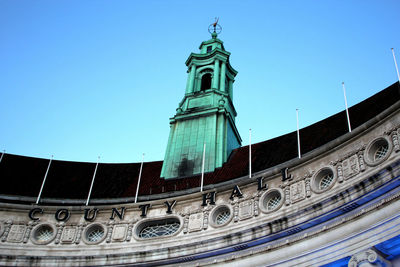 Low angle view of building against blue sky