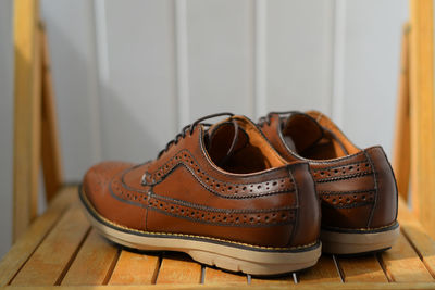 High angle view of shoes on wooden table