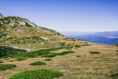 Scenic view of mountains against clear blue sky