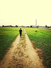 Full length of man walking on road