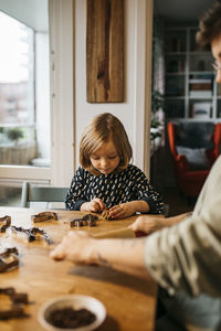 Mother and daughter making cookies