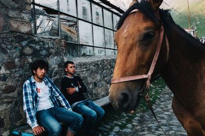 Portrait of friends standing outdoors