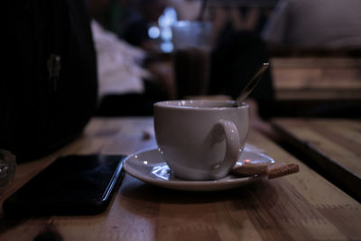 Close-up of coffee cup on table