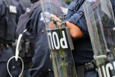 Upside down police riot shield during protest, selective focus.