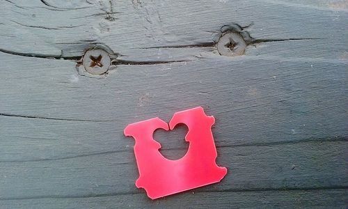 Close-up of heart shape on red surface