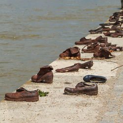 High angle view of shoes on beach